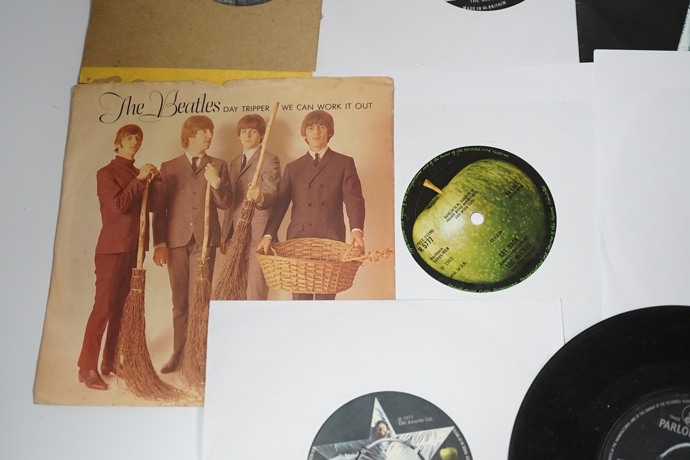 Thirteen The Beatles and related 7 inch singles; eight of which have demo stickers; ‘Factory Sample Not For Sale’